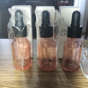 Young Living Pink bottles with glass droppers.  Essential oils mixtures.  15 ml